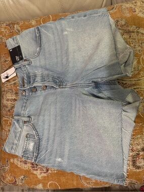 Light Wash Denim Button-Fly denim shorts raw hem